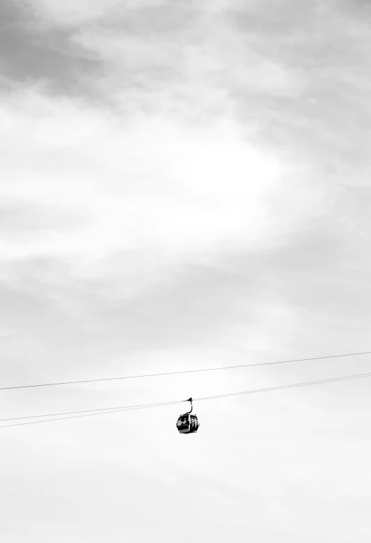 a person standing on a beach holding an aerial vehicle