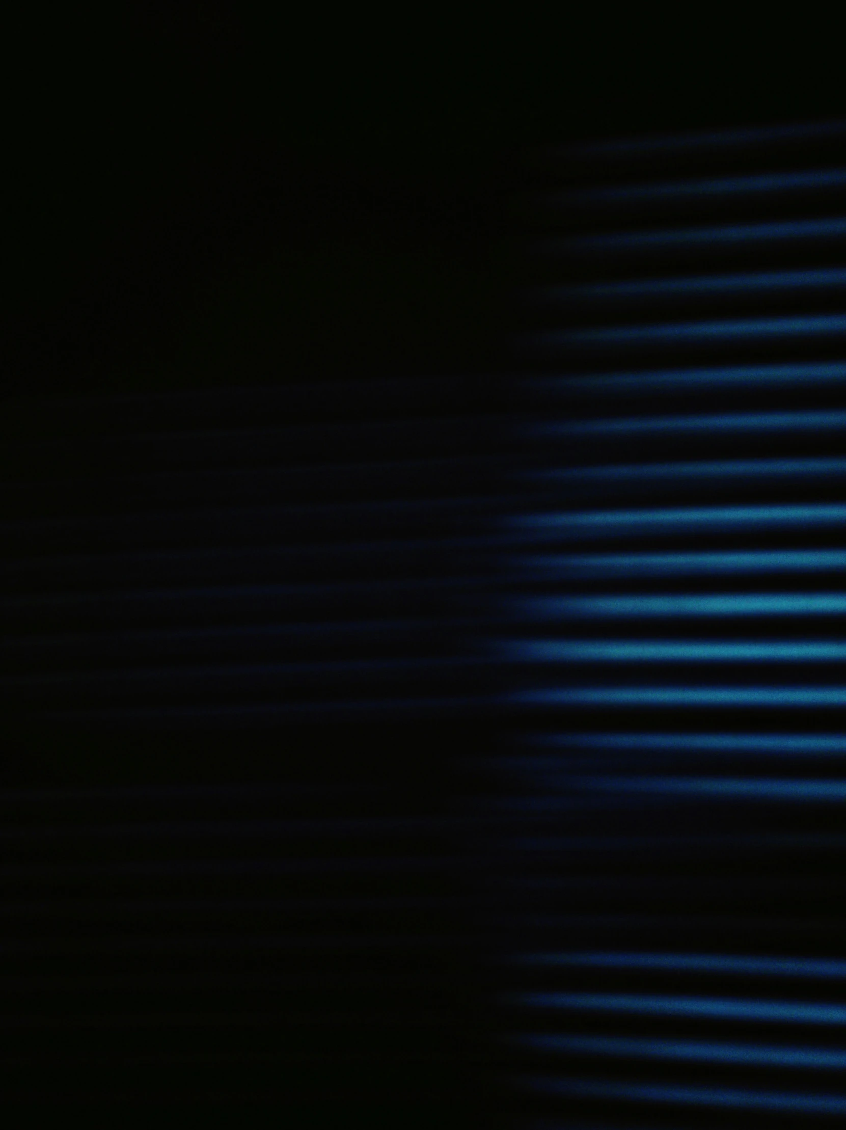 a black background with a blue wall and some lines