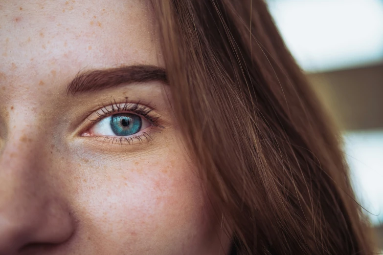 a woman's blue eye is very blue