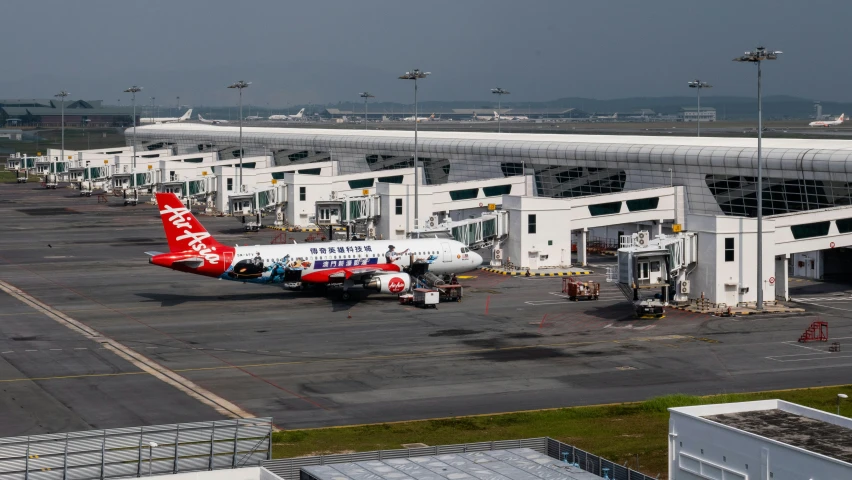 an airplane is in an airport, with other planes around