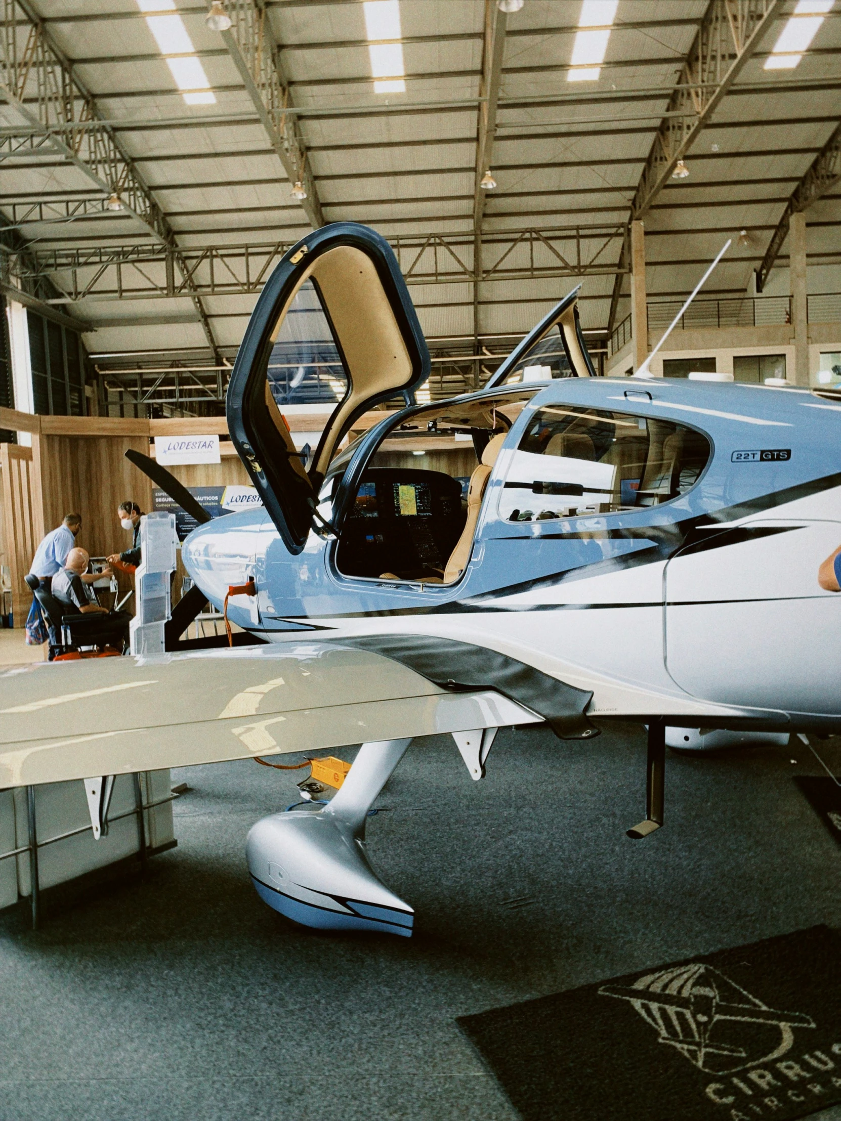 a plane in a hanger, with a door open