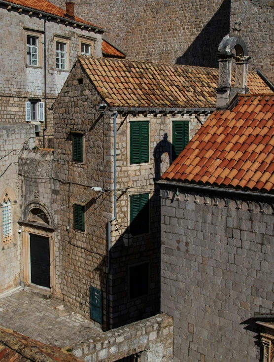 a brick and stone building with two courtyards