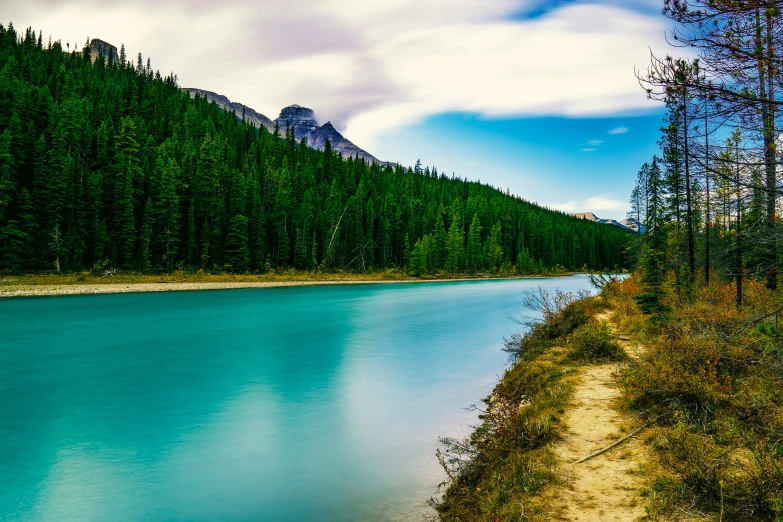 a beautiful blue lake surrounded by a mountain