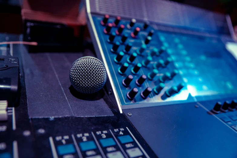 there is a microphone sitting on top of a laptop computer