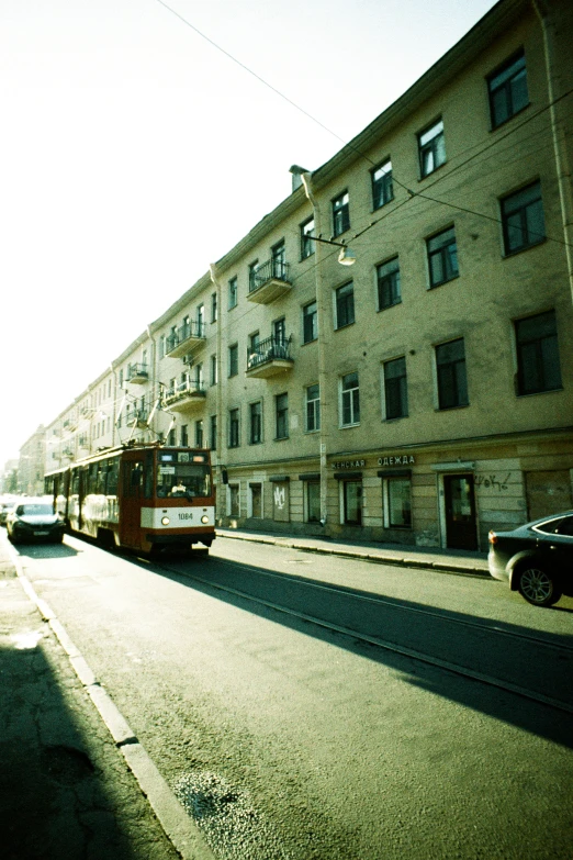 a large brown building next to street