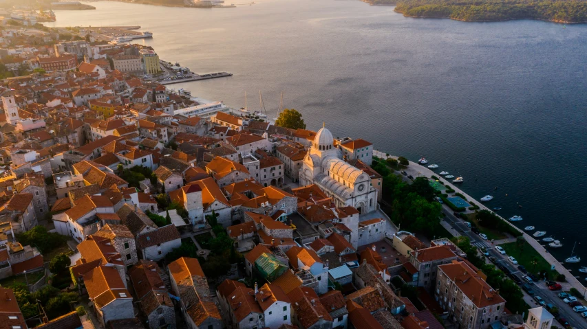 an aerial view of a town and water