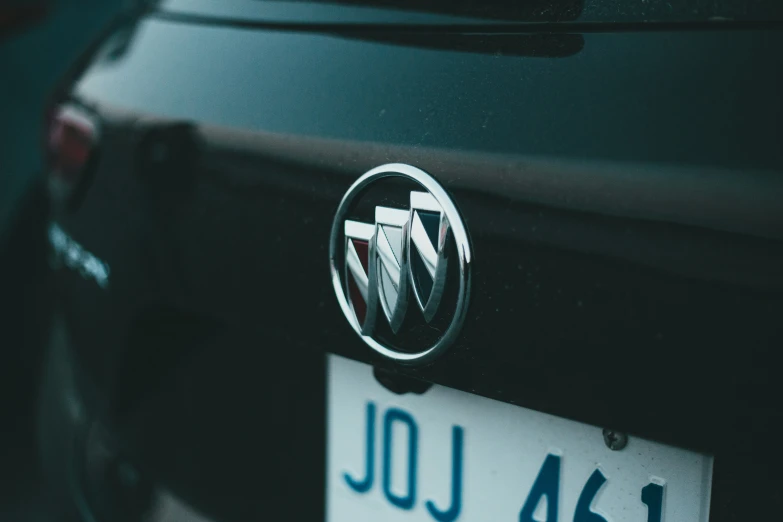 a volkswagen logo is displayed on the front bumper of a car