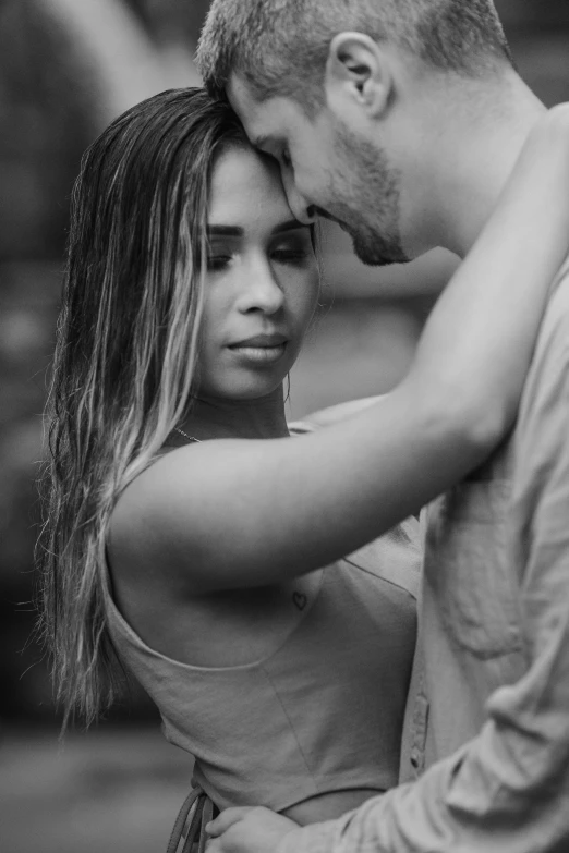 a beautiful couple posing in black and white