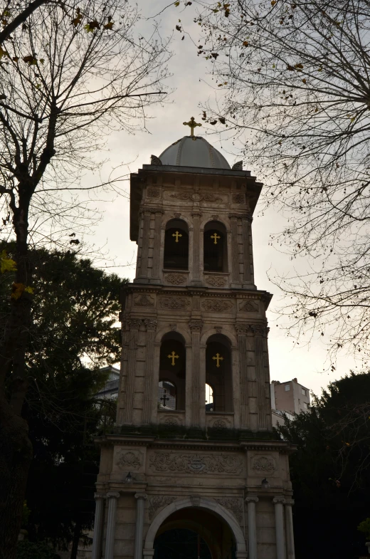 a church steeple is featured against the sky