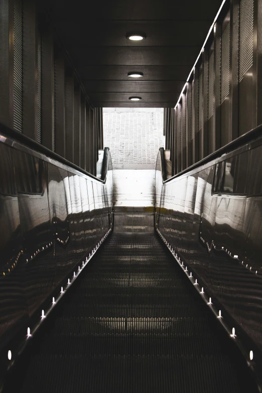 an empty subway station that is very dark