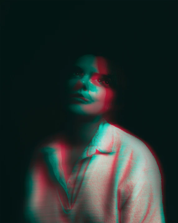blurry image of an individual in a dark room