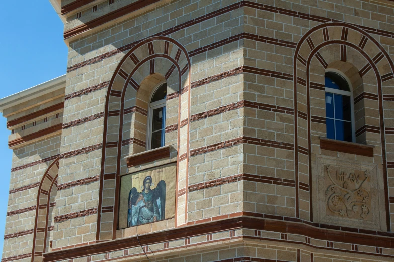 an old building with two decorative window frames