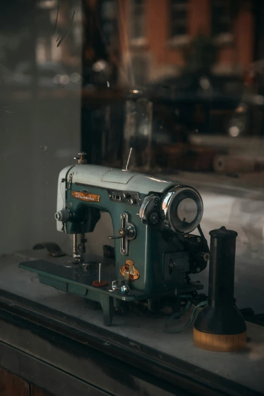 old sewing machine on display in shop window