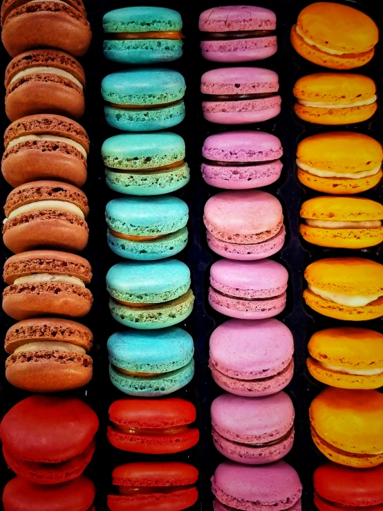 a selection of colorful, freshly baked macarons