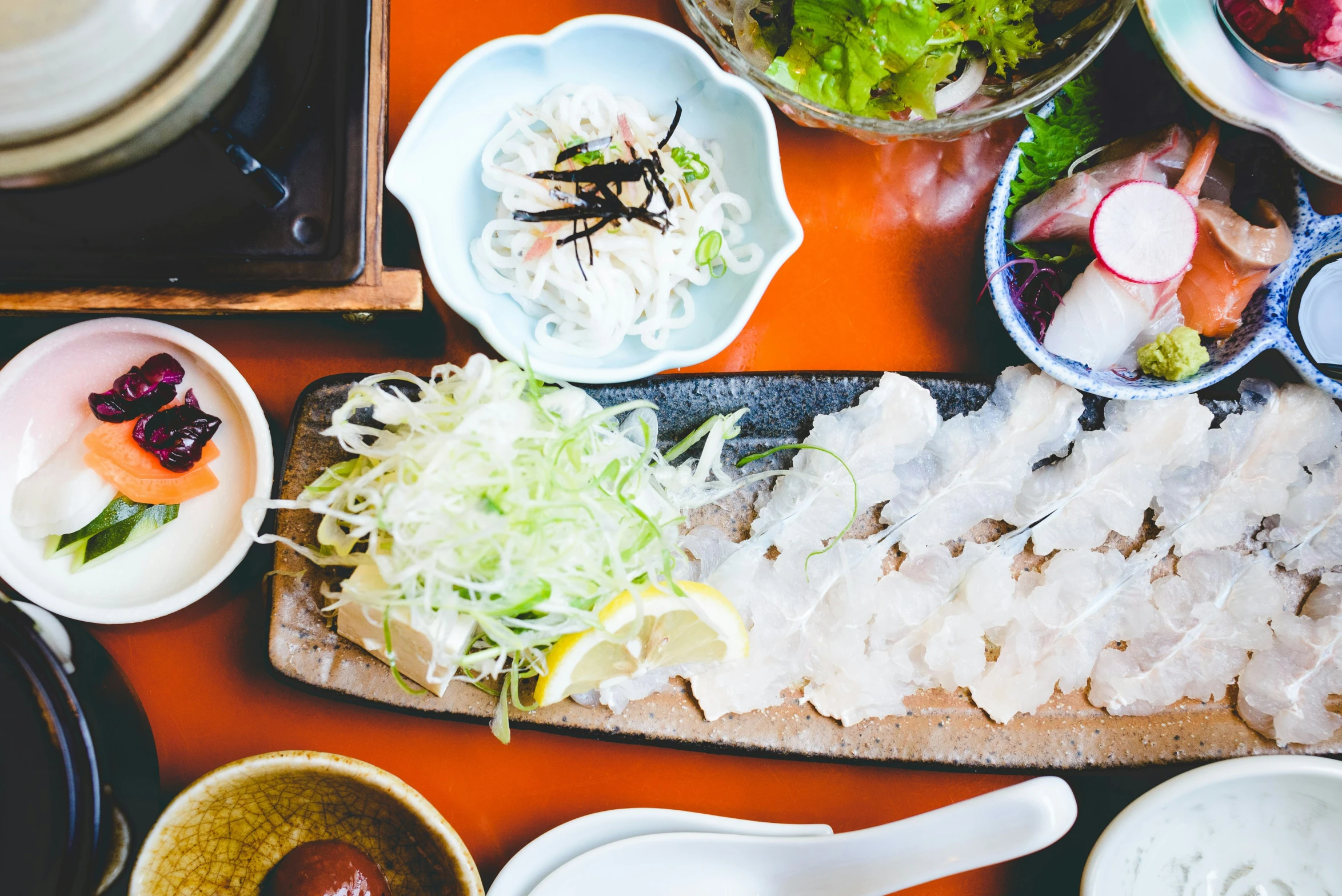 this is a variety of sushi on a table