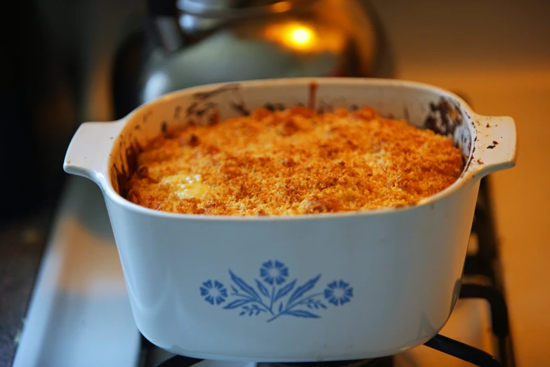 an oven filled with a casserole on top of a stove