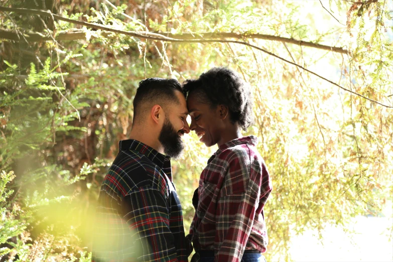 a man and woman smile into each other's eyes