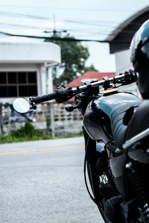 the handlebars on a motorcycle are visible from behind