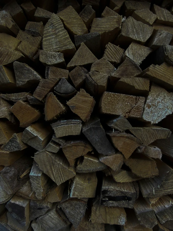 a pile of cut logs made up of wooden pieces