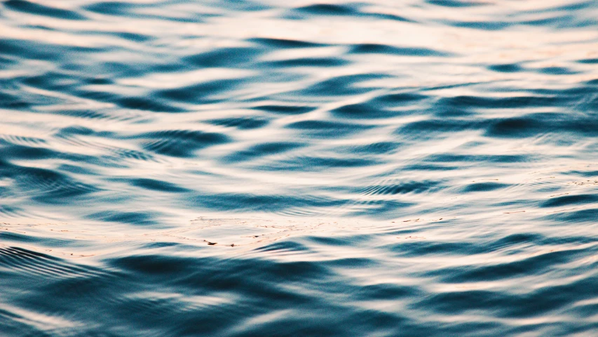 a blurry po of some water with small ripples