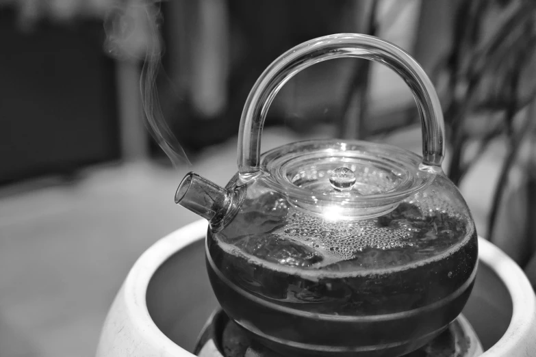 a tea kettle is sitting on a small table