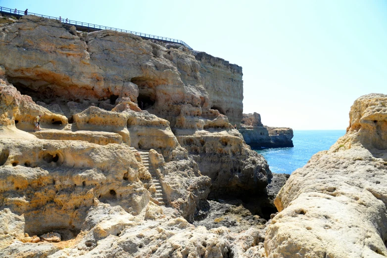 the view of some rocky terrain and a body of water