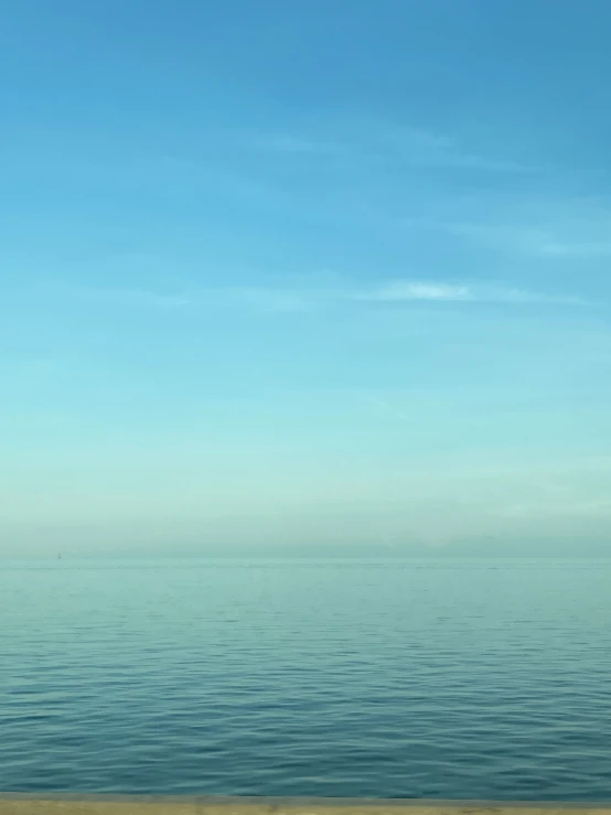 a bench that is overlooking some very calm water