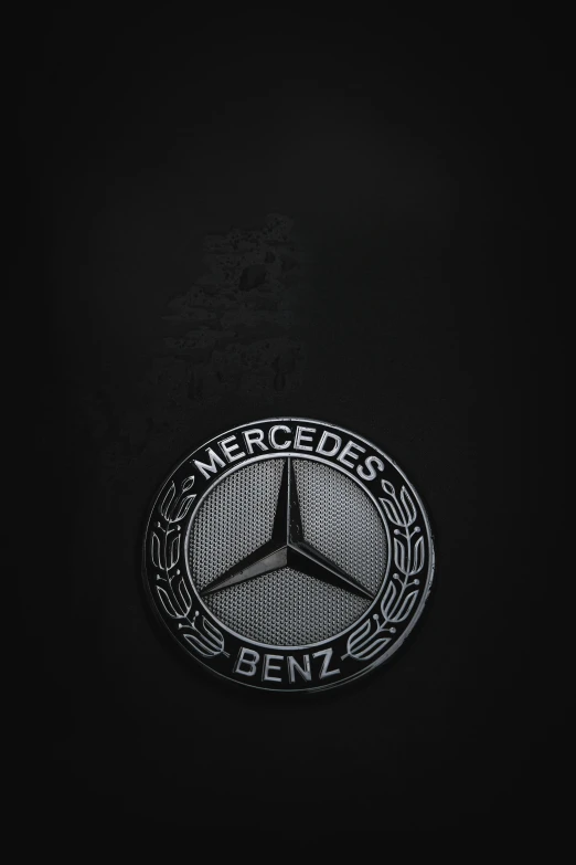 mercedes benz logo is shown on the black background