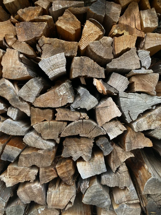 a pile of wood is piled on top of each other