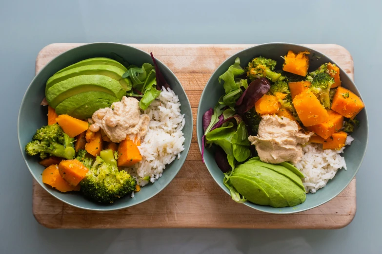 two bowls filled with different kinds of foods