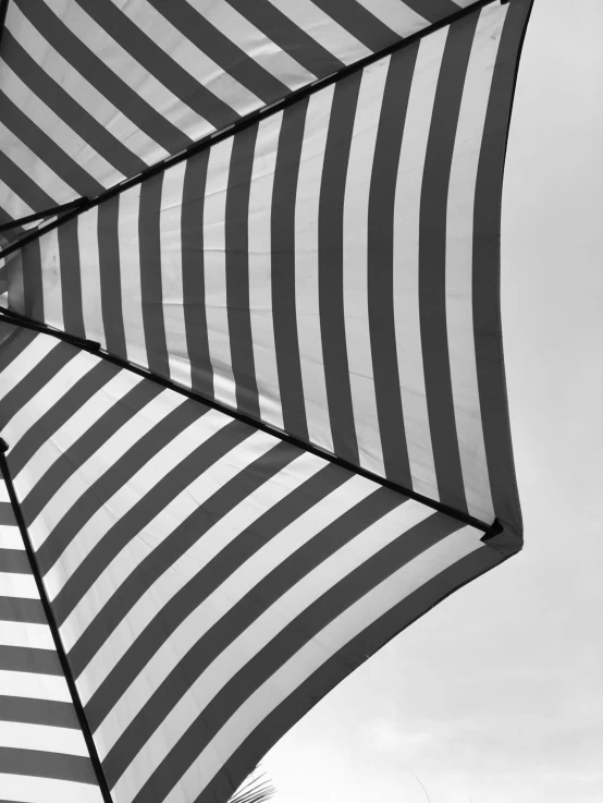 two people under umbrellas with their backs turned towards one another