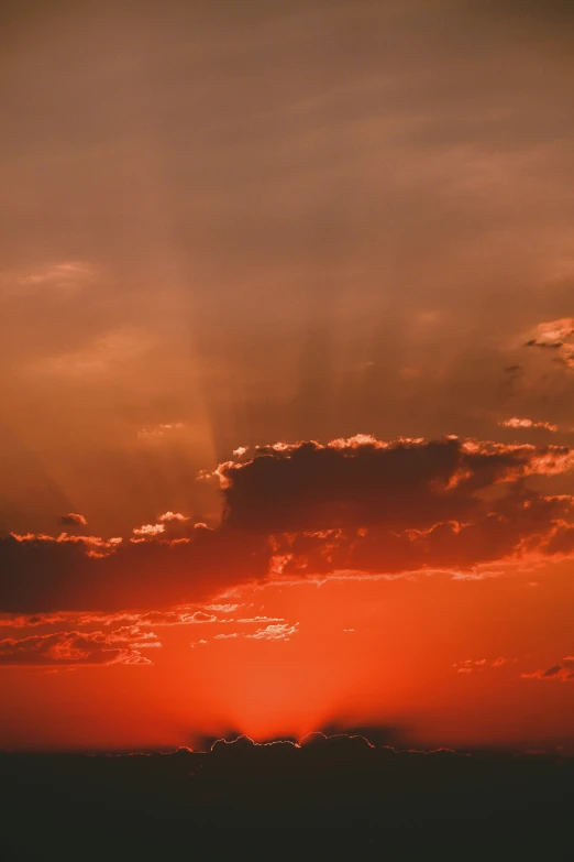 a person is on a surfboard in the sunset