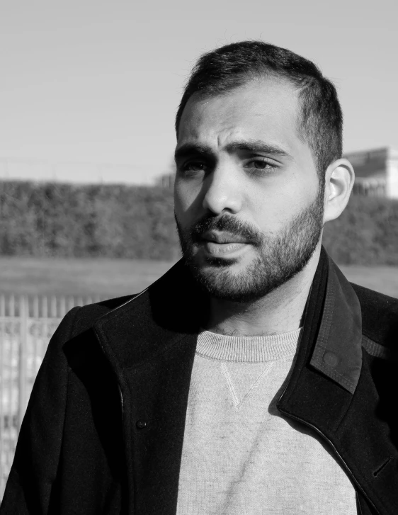 a bearded man in black and white