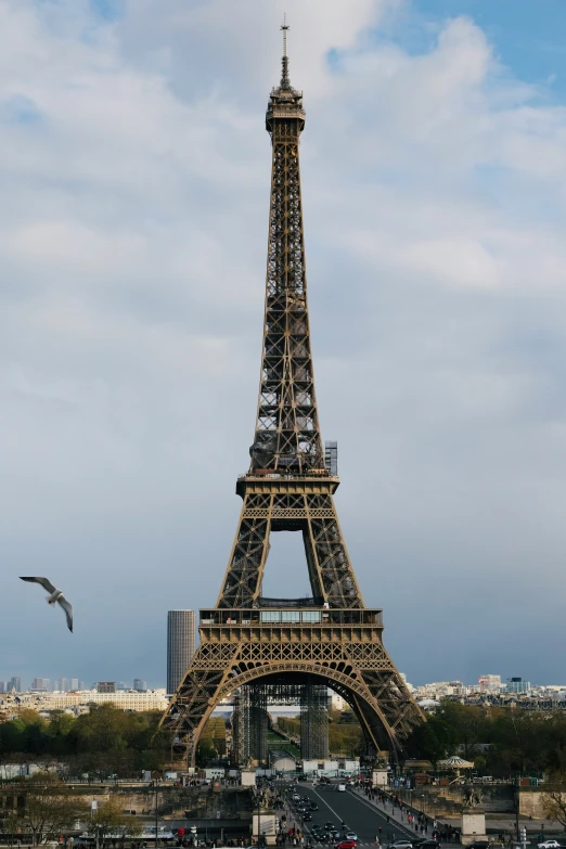 the eiffel tower is situated by a parking lot