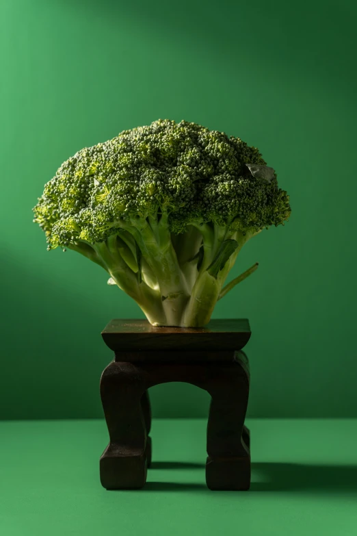 a head of broccoli in a wooden container