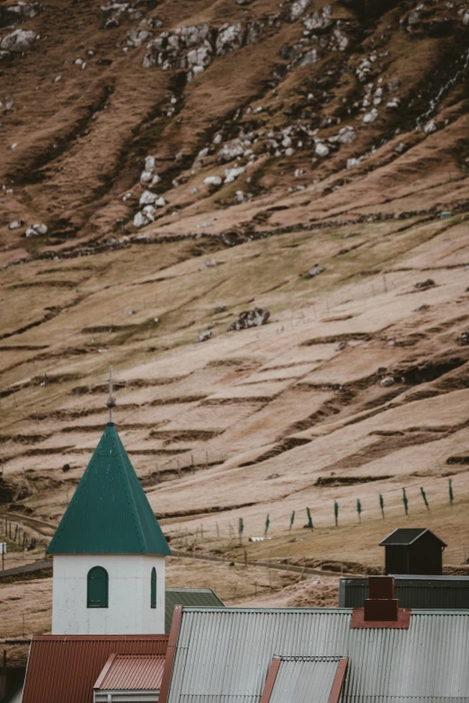 an image of a field with hills in the background