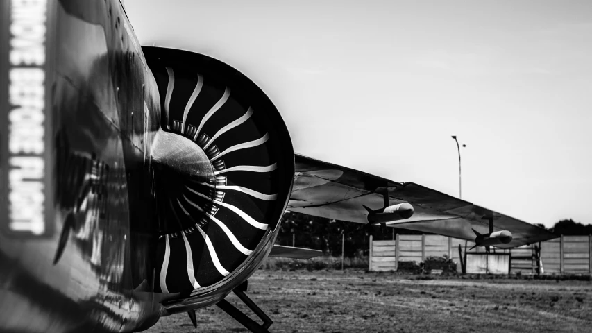 close up of a jet engine in an open field