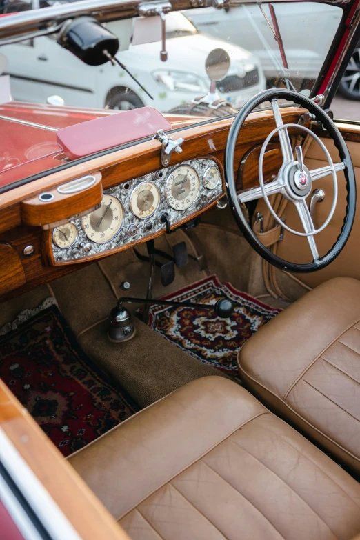 inside view of a classic convertible car sitting in a driveway