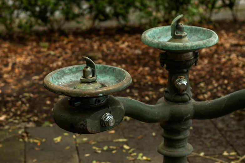 two old fashioned faucets in a public park