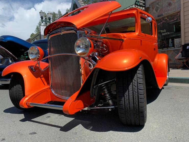 an orange truck parked on a parking lot