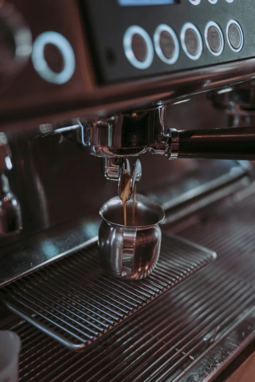 a coffee machine dropping  liquid from it