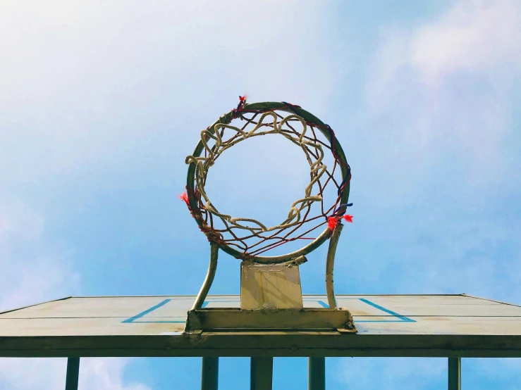 a wreath atop a roof top with birds