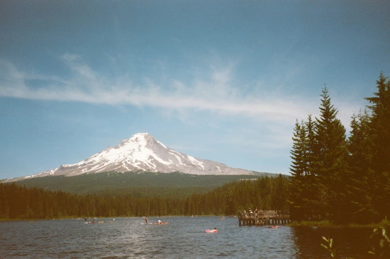 a picture of a mountain sitting over water