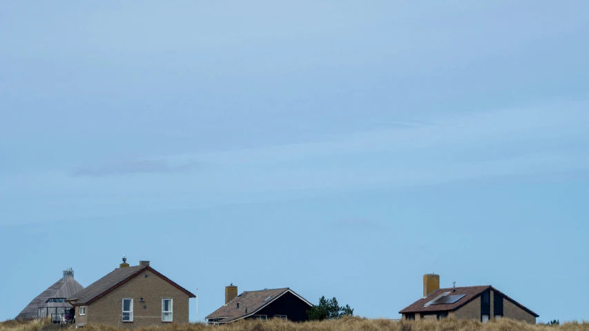 an airplane flying low over some houses