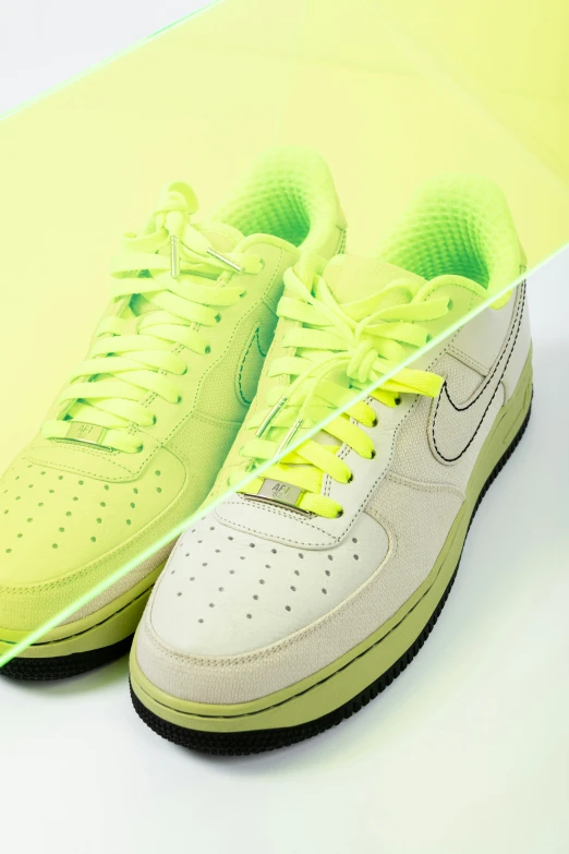 the sneaker is brightly colored and neon yellow