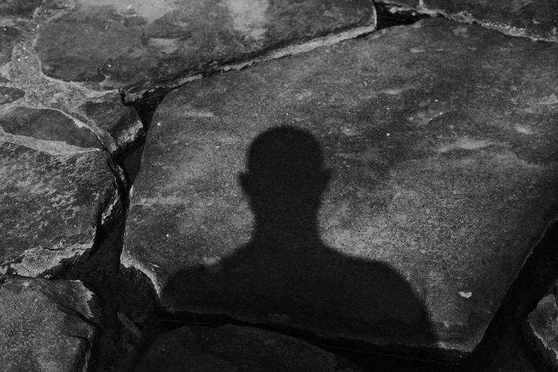 a black and white po of a man shadow