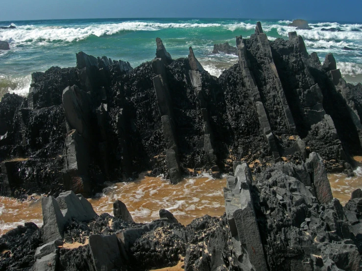 rocks and water, against a dark background