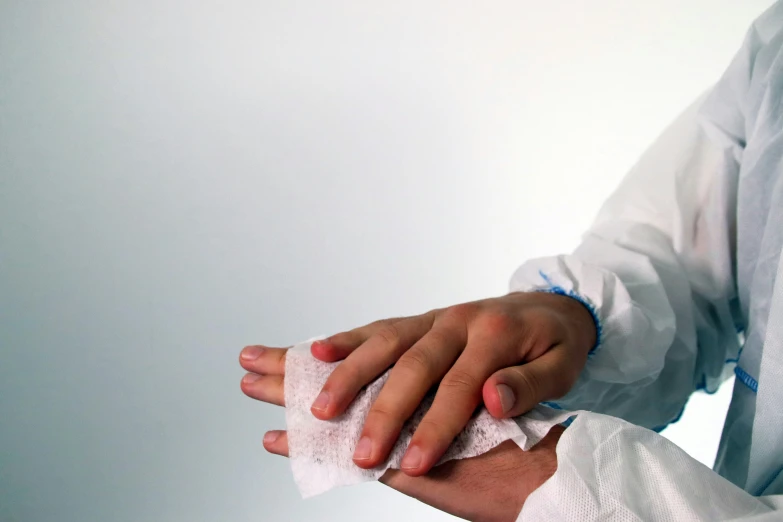 a hand is gripping the top of a pair of hand bandages