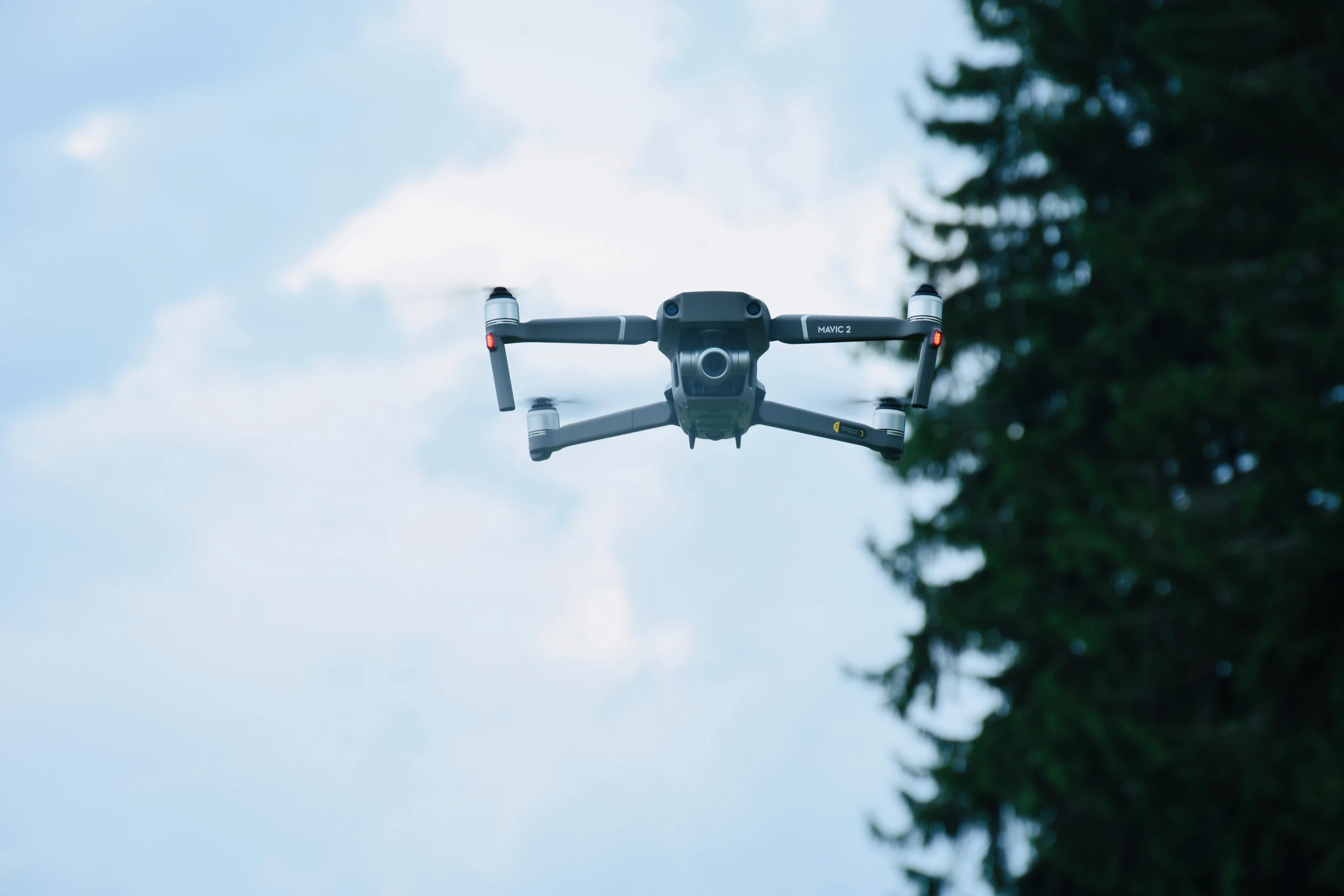 a small grey and black remote controlled aerial device