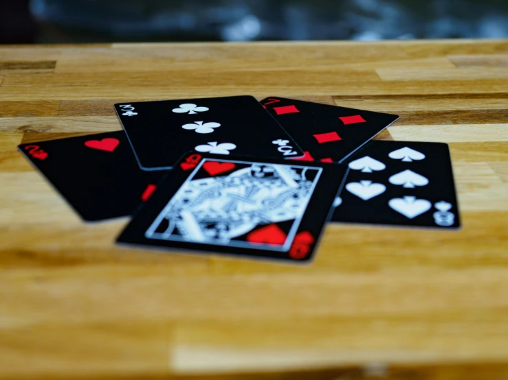 three cards in different sizes lie on a table